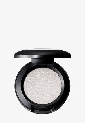 Palette ronde d'ombre à paupières argentée avec produit texturé et scintillant de couleur gris clair. Compact en plastique noir avec un couvercle lisse, légèrement surélevé.