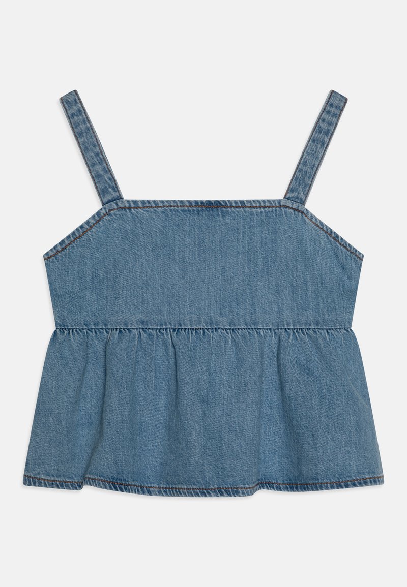 Blue denim peplum top with thin adjustable straps, featuring a structured bodice and gathered hem. Lightly textured fabric.