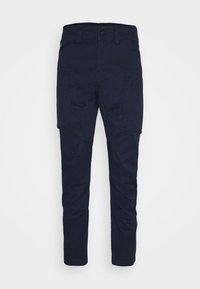 Marineblaue Cargo-Hosen aus einem Baumwollmischgewebe, mit zwei seitlichen Taschen, einem Knopfverschluss und schmal zulaufenden Beinen. Weiche Textur, minimalistisches Design.