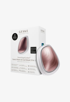 Sonic varm og kølig ansigtsmaske med et glat, buet design i rosaguld og hvid; emballagen har tekst og logoer.
