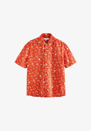 Lühikeste varrukatega nööbiga särgiga, mis on valmistatud erkoranžist kangast koos valge troopilise mustriga. Omab klassikalist kraed ja sirget allääret.