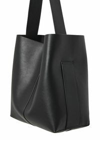 Sac fourre-tout en cuir noir avec des anses larges et un design lisse et minimaliste, présenté sur fond blanc.