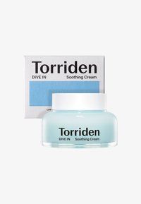 Torriden DIVE IN Soothing Cream dalam jar transparan dengan tutup putih. Kotak dilengkapi aksen biru dan teks hitam di latar belakang putih.