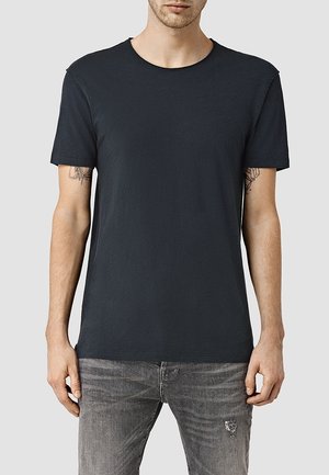 Dunkelgraues T-Shirt mit kurzen Ärmeln aus weicher Baumwolle. Verfügt über einen klassischen Rundhalsausschnitt und dezente Used-Effekte an den Ärmeln.