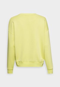 Yellow sweatshirt with a round neckline, ribbed cuffs, and hem. Soft fabric with a smooth texture, featuring drop shoulder seams.