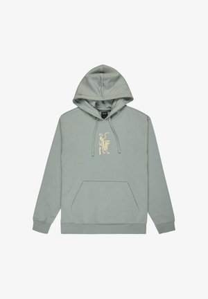 Bluza z kapturem w jasnozielonym kolorze, z kieszenią kangurką oraz haftowanym w kolorze beżowym wzorem tygrysa na klatce piersiowej. Gładka tekstura.