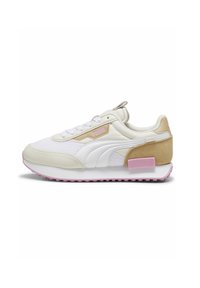 White and beige sneaker with a textured fabric upper, pink accents, rounded toe, and thicker sole. Features a pull tab on the heel.