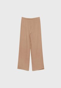 Beige wijde broek met een elastische tailleband, gemaakt van zacht, lichtgewicht stof, weergegeven tegen een effen lichte achtergrond.