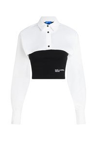 Cropped shirt featuring a white collared top and black fitted bottom, with button detailing and "KARL LAGERFELD JEANS" logo on the front.