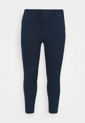 Donkerblauwe denimlegging met een strak, rekbaar ontwerp. Voorzien van een elastische tailleband, enkellange snit en klassieke vijfzakkenstijl.