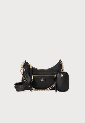 Black handbag made of fabric with gold-tone hardware, featuring a zippered pocket, a detachable chain strap, and a small matching pouch.