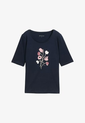 T-shirt en coton bleu marine avec un col rond et des manches courtes, ornée d'un imprimé floral rose et blanc sur le devant.