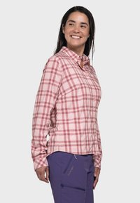 Leichtes, langärmliges Hemd mit Knopfleiste in Pink mit einem weißen und roten Karomuster. Verfügt über einen Kragen, eine Brusttasche und seitliche Reißverschlüsse.