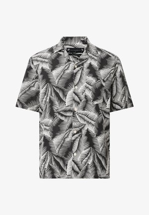 Chemise à manches courtes à motif de feuilles noir et blanc, présentant un col structuré et une texture de tissu lisse.