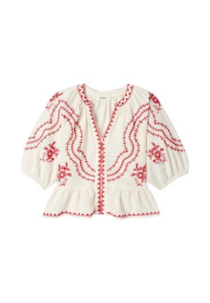 Blouse blanche avec broderie florale rouge, manches trois-quarts bouffantes, encolure ronde, fermeture boutonnée devant et bas à volant peplum.