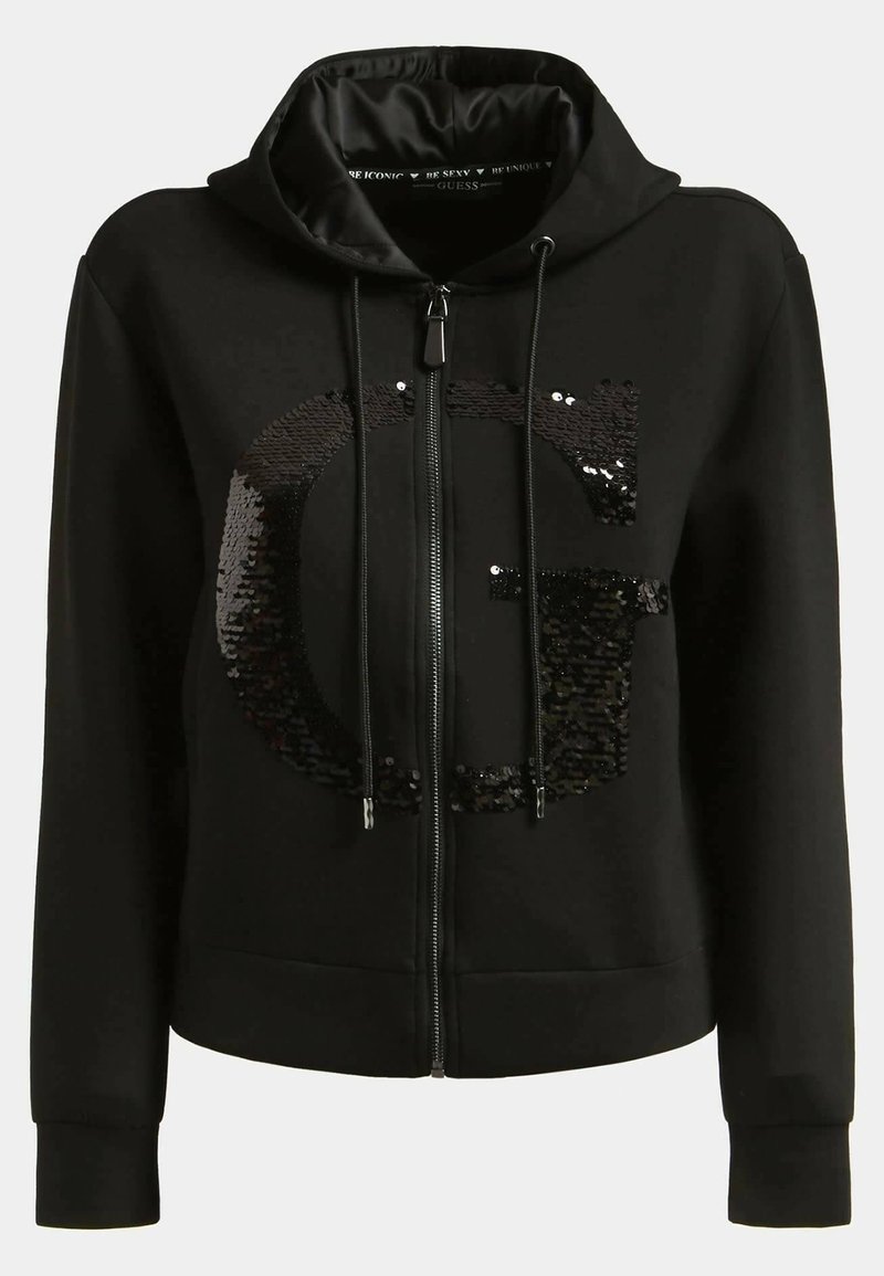 Sweat à capuche noir zippé avec cordons, arborant un grand logo "G" en sequins sur le devant, poignets côtelés et coupe décontractée.