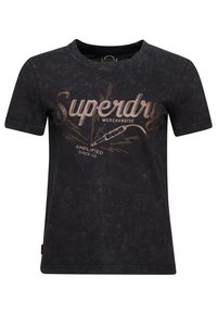 Musta puuvillapaita, jossa on pyöre�ä pääntie, ja joka on varustettu metallinhohtoisella pronssivärisellä "Superdry"-grafiikalla sekä kuluneen näköisellä koristekuvalla.