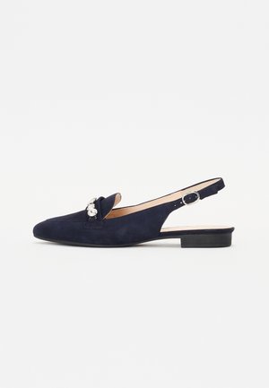 Navy blue suede slingback shoes with a pointed toe, featuring a decorative bow and pearl accents, and a low block heel.