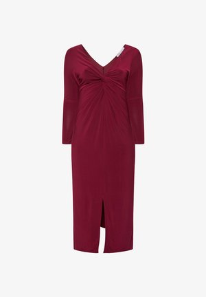 Bordeaux jurk met een V-hals, lange mouwen, een twist-detail op de taille en een split aan de voorkant. Zachte stof met een gladde textuur.