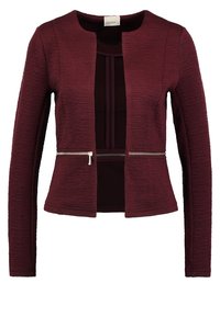 Veste texturée bordeaux à manches longues, fermeture zippée à la taille et encolure arrondie ; dotée d'une doublure intérieure lisse.