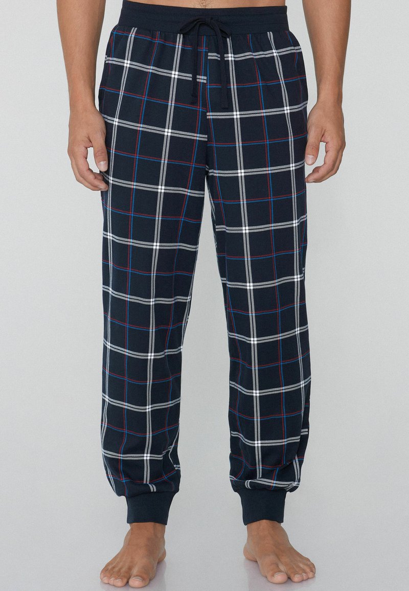 Navyblaue karierte Schlafanzughosen aus weicher Baumwolle, mit weißen und roten Linien, elastischem Bund mit Kordelzug und gerafften Knöcheln.