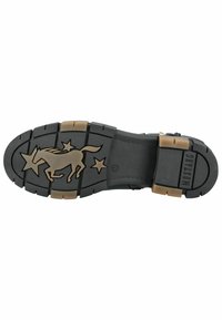 Semelle de chaussure en caoutchouc noir présentant un cheval au galop et des étoiles, dotée de motifs texturés pour l'adhérence et d'accents beiges dans la zone du talon.