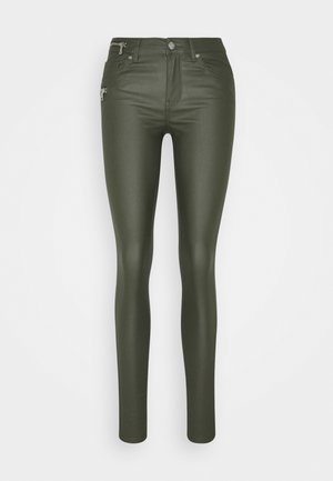 Olive green, high-waisted skinny jeans made of a smooth, stretchy material. Features silver hardware and zippered front pockets.