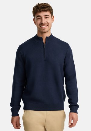 Marineblauer Pullover mit hohem Kragen und kurzem Reißverschluss. Verfügt über gerippte Bündchen und Saum und ist aus einem weichen, glatten Stoff gefertigt.