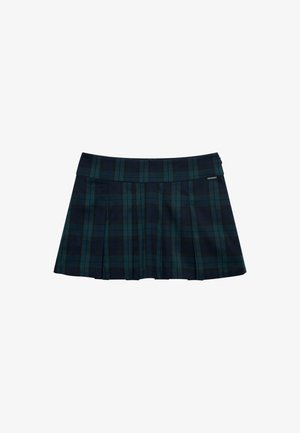 Jupe plissée à carreaux en vert foncé et bleu marine avec une ceinture lisse et un accent logo. Présente un design classique à plis superposés.