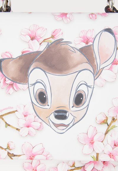 White handbag featuring a cartoon deer face, surrounded by pink floral patterns. Smooth texture, with light colors and simple design accents.