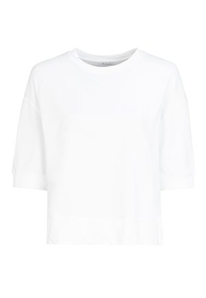 T-shirt blanc à manches courtes en coton. Avec un col rond et une silhouette ample, il présente un léger froncé au niveau des poignets.