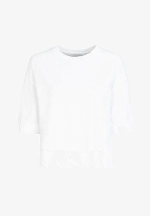 T-shirt blanc à manches courtes en coton. Avec un col rond et une silhouette ample, il présente un léger froncé au niveau des poignets.