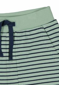 Randiga pyjamasbyxor i ljusgrön och marinblå, med ett mjukt elastiskt midjeband och snörning, med horisontella ränder över hela byxorna.