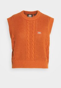 Orange knitted sleeveless sweater featuring cable and ribbed textures, with a round neckline and a small brand logo on the front.