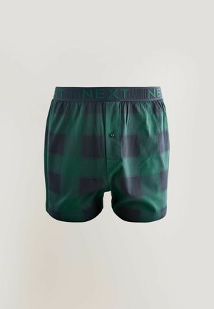 Grønne ternede boksershorts med sort ternet mønster, elastisk linning med "NEXT"-branding, knaplukning foran og glat stoftype.