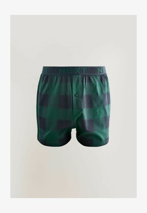 Zelene karirane bokserice s crnim karo uzorkom, elastični pojas s natpisom "NEXT", jednoga gumba na preklopu i glatke teksture tkanine.