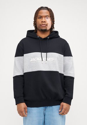 Black and grey hoodie with a front pocket, drawstrings, and a logo print. Features a color-block design with soft texture.