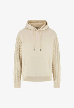 Beige hoodie with a front pocket, hood, and textured cable knit sleeves. Features drawstrings with metal tips and ribbed cuffs.