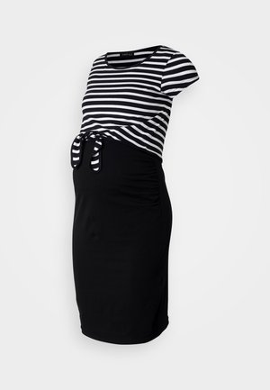 Black and white striped maternity dress with short sleeves, a tied front detail, and gathered sides, made from soft, stretchy fabric.