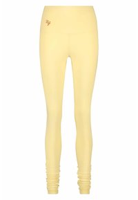 Geel leggings van een gladde, rekbare stof. Hoge tailleband met een subtiele logo in een contrasterende kleur. Getailleerd ontwerp met gathered enkel details.