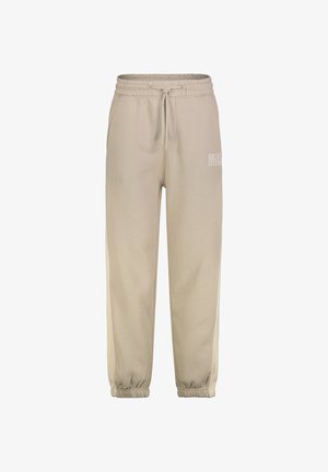 Beige Sweatpants mit elastischem Bund und Kordelzug, Seitentaschen, elastischen Bündchen und weißem "SBLVSTUDIO"-Schriftzug am linken Oberschenkel.
