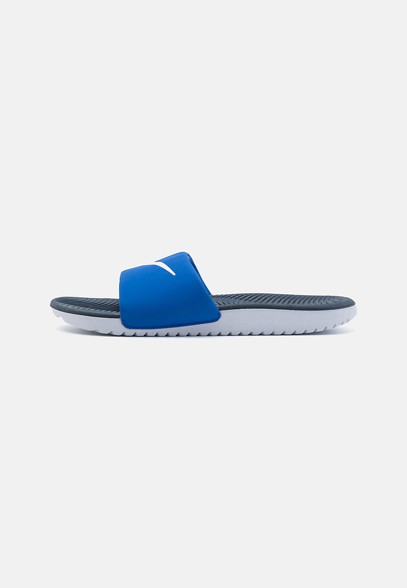 Blue slide sandal with a wide strap and textured insole. White accent logo on the strap. Grey outsole with a zigzag pattern for grip.