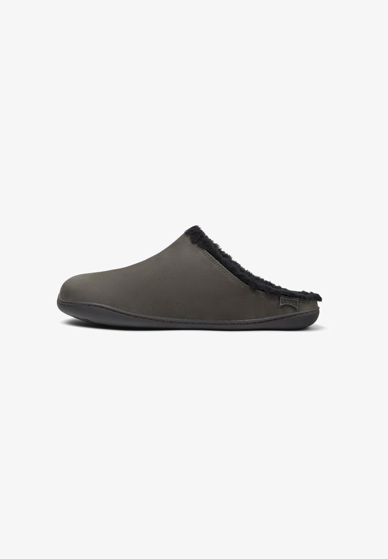 Dark gray slipper with a smooth surface, black fur trim at the opening, and a flexible black sole. Features subtle stitching details.
