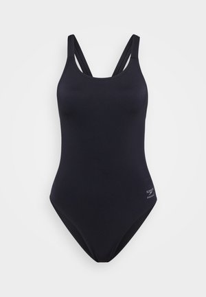 Maillot de bain noir une pièce avec des bretelles croisées doubles et un petit logo Speedo Endurance sur la hanche, présenté sur un fond blanc.