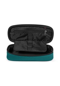 Custodia con zip, esterna in tessuto teal e interna nera. Presenta un compartimento diviso e una piccola tasca con zip.