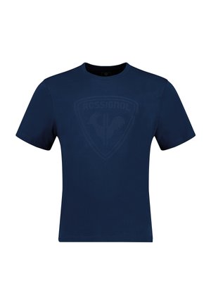Navyblaue Baumwoll-T-Shirt mit Rundhalsausschnitt und kurzen Ärmeln. Verfügt über ein dezentes, tonal gehaltenes Logo-Design auf der Vorderseite. Glatte Textur.