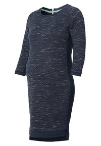 Tummansininen mekko, jossa on tekstuurilla varustettu kangas, jossa on hienovarainen kuvio. Pitkät hihat, pyöreä pääntie ja vetoketjukiinnitys selkäpuolella.