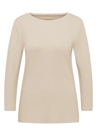 T-shirt beige à manches longues en tissu doux, avec un col rond et une coupe droite. Aucun motif ni accent visible.
