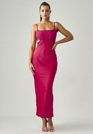 Fitted magenta dress with spaghetti straps, a textured bodice, side cutouts, and a sleek floor-length skirt. Smooth, stretchy fabric.