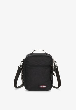 Borsa a tracolla nera in tessuto con compartimento principale con cerniera, tasca frontale, tracolla in nastro e logo Eastpak. Dotata di una tasca laterale in rete.